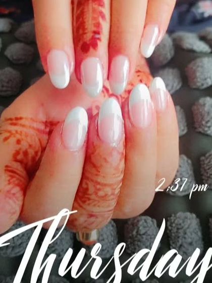 Another view of the classic French manicure, showing how the clean lines stand out against the detailed henna design.