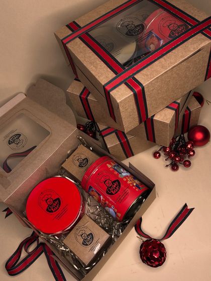 Our Ultimate Christmas Hamper, all boxed up and ready for gifting. I make sure the packaging is as special as the treats inside, with festive ribbons and a clear window to peek at the goodies.