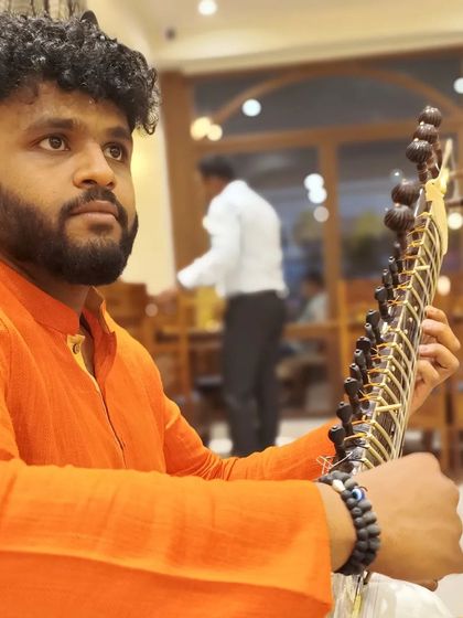 A candid shot taken by my friend Prashant. The quote "When you play, never mind who listens to you" is a reminder to always play from the heart.