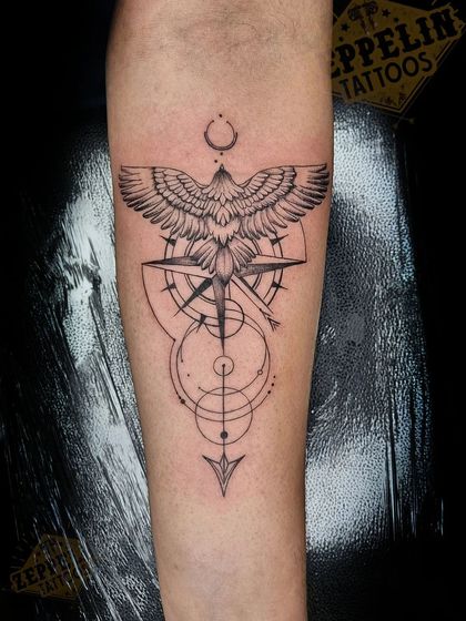 A custom wanderer tattoo combining an eagle, a compass, and an arrow with geometric elements. This piece is all about freedom, direction, and the journey forward.