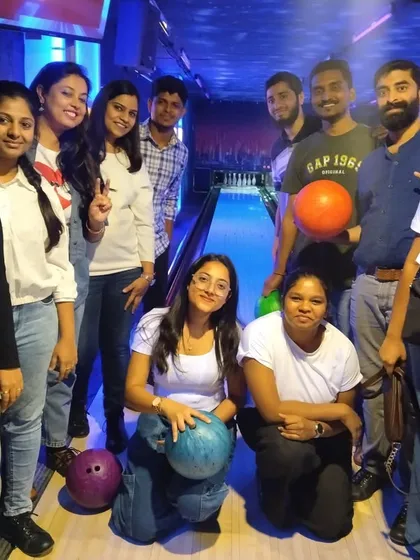A group of friends posing for a photo at our bowling alley. It's the perfect place for a weekend hangout.