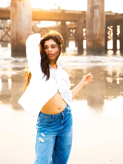 The wind, the light, and the pose all come together in this dynamic shot. It has a beautiful sense of movement and freedom.