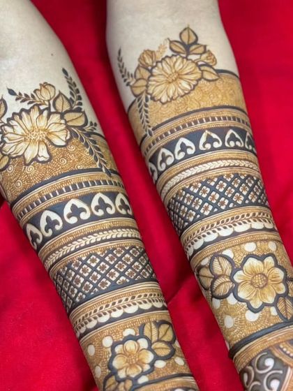 A full view of the floral band design on both arms, showing the symmetry and the beautiful contrast between dense and open patterns.