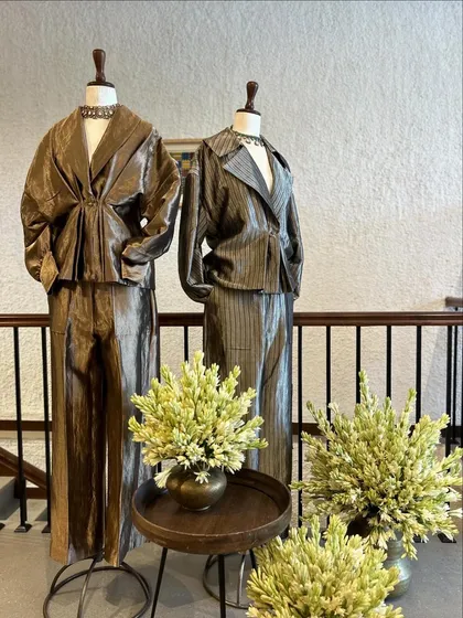 The two metallic co-ord sets displayed together, showcasing a modern and edgy approach to celebration wear.