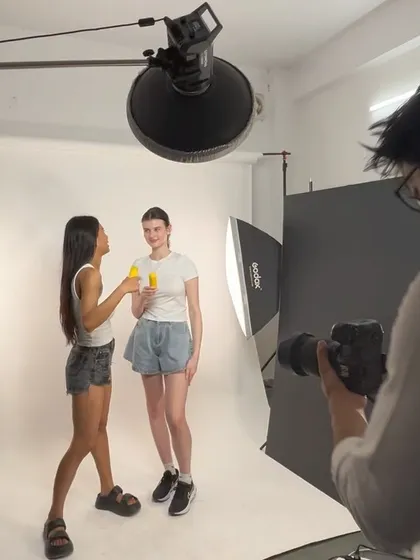 A fun moment on set. This behind-the-scenes shot captures the energy and collaboration between our photographer and the models during a skincare campaign shoot.