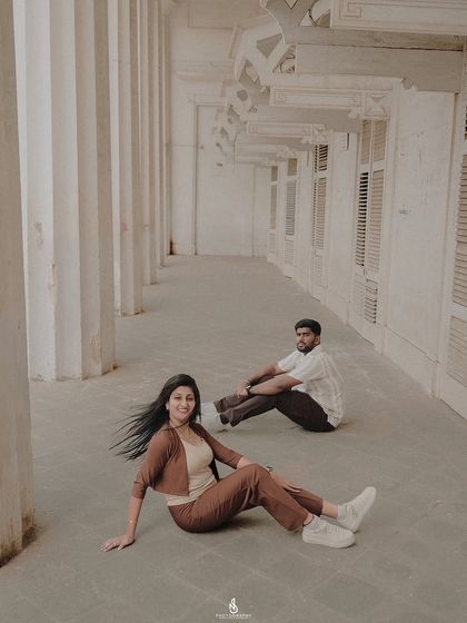 A creative composition in a long hallway, playing with distance and space to create an artistic portrait.