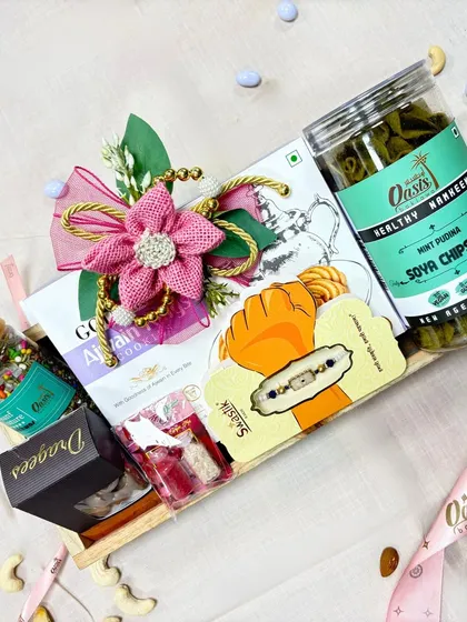 A healthy and delicious Rakhi gift. This hamper includes Mint Pudina Soya Chipstix, dragees, and other treats, perfect for the health-conscious sibling.