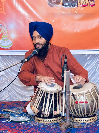 Addressing the audience during my tabla solo performance. I often like to explain the compositions I am about to play.