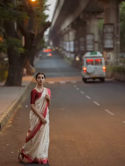 A wide shot from the Bengaluru street series, capturing the early morning light and the quietness of the city before it wakes up.