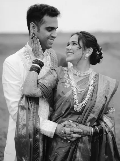 A timeless black and white portrait from a Maharashtrian couple's shoot. By removing color, we focus entirely on the expressions and the tender way they look at each other. This style brings a classic, emotional depth to cultural photography.