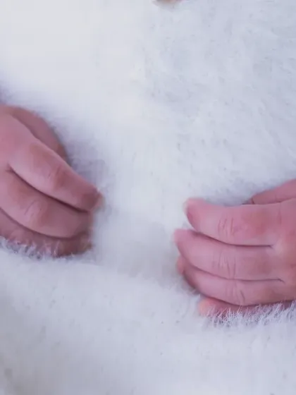 The delicate, tiny hands of a newborn resting peacefully. These are the fleeting moments I aim to freeze in time for you during our newborn photoshoots.
