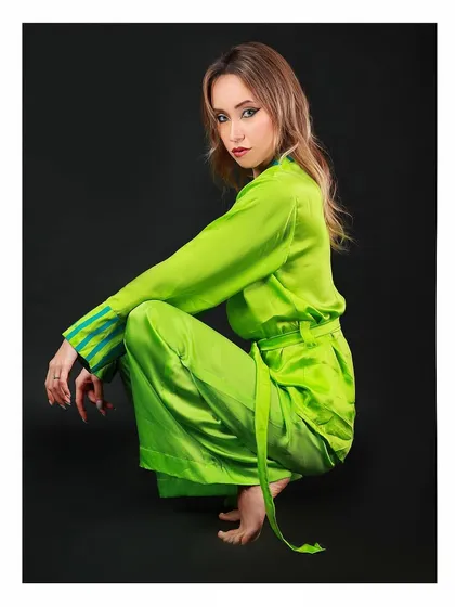 Another look from the LSTSOLES brand shoot, featuring a dynamic pose that highlights the flow and style of the garment against a classic black background.
