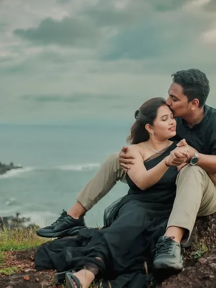 Using nature's drama to highlight a couple's connection is one of my favorite things to do. This pre-wedding photo, taken on a cliff overlooking the Kokan coast, captures a powerful and romantic moment against an incredible landscape.
