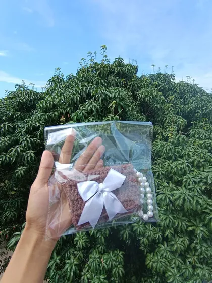 Another color variation of the pocket purse, also packaged and ready to go. This one features a different ribbon style.