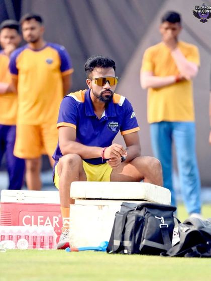 Taking a moment during a training session. The intensity of professional cricket requires periods of rest and observation to ensure players are not over-trained.