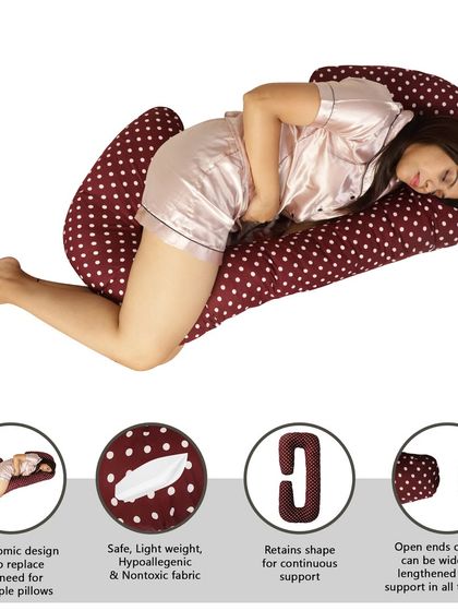 A comprehensive infographic for a maroon pregnancy pillow, demonstrating its ergonomic design and other key features with a model.