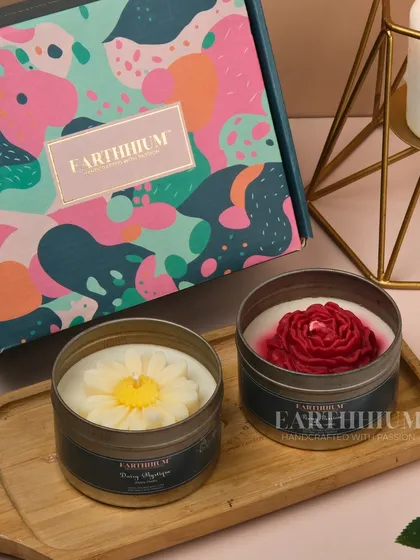 A daisy and a rose tin candle paired together in one of my colorful gift boxes.