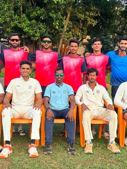 A mix of our players in training gear and match whites pose for a team photo, showcasing the diverse group of cricketers who represent Payyade Sports Club.