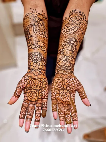 A beautiful floral mehendi with large rose motifs on the palms, created by my talented team. This style is perfect for someone who loves bold flowers.