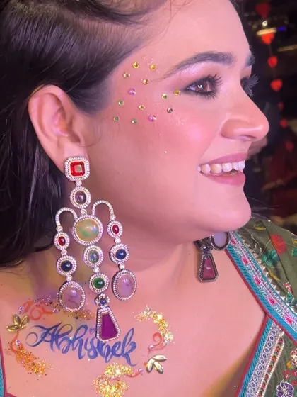 A special glitter tattoo for the happy bride, with her groom's name, Abhishek. This is such a sweet and personal way to add some fun to your Mehendi or Sangeet look.
