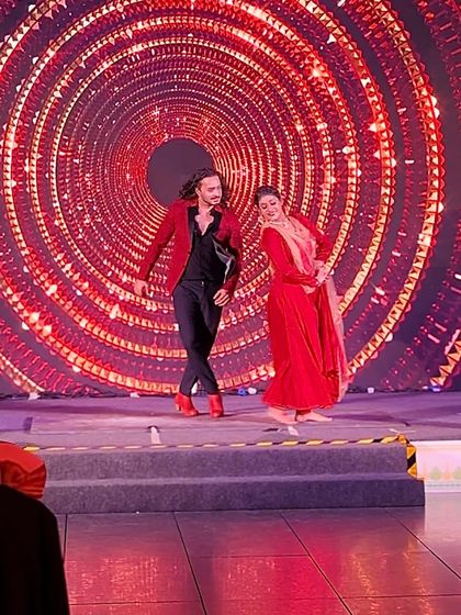 A full-stage view of a Flamenco-Kathak duet against a mesmerizing LED backdrop.