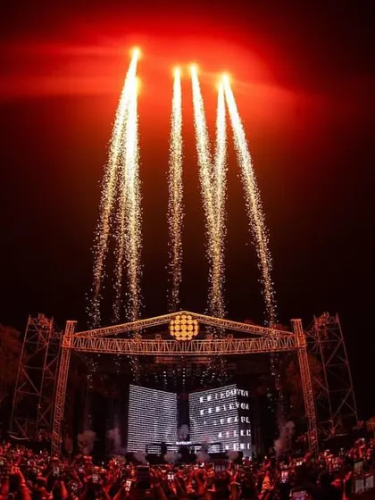 Red lights and perfectly timed fireworks create a dramatic and powerful moment during the DVLM show.