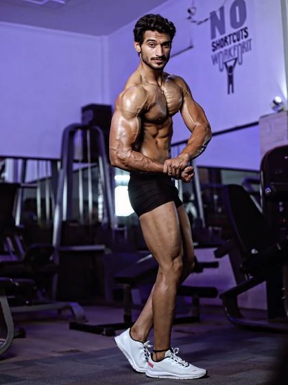 Side chest pose in the gym. This is one of the mandatory poses that I practice relentlessly to perfect every detail for the stage.