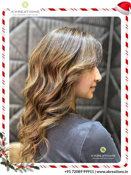 These warm, golden highlights are perfect for adding a 'wow' factor. Styled with soft waves, the hair looks voluminous, healthy, and incredibly vibrant.