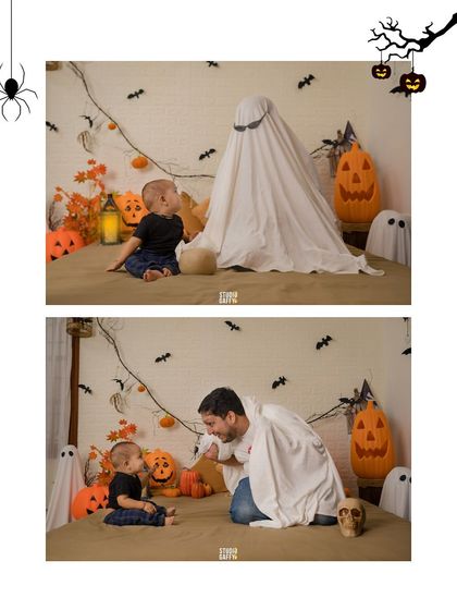 The big reveal! Dad lifts his ghost costume to surprise his little one.