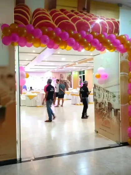 Balloon arches are a great way to welcome guests to a party. For this event, I made a simple yet festive entrance arch using pink and gold balloons to match the party's color theme.