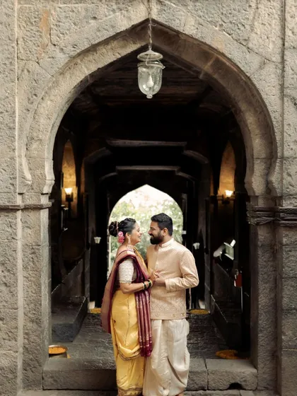 Framed by the ancient stone archway of a temple, this couple shares a quiet moment. The historic setting adds a sense of permanence to their connection. I love finding these architectural frames that add depth and story to a portrait.