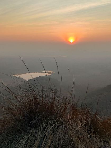 The golden hour sunrise from the top of Uttari Betta, a truly magical sight.