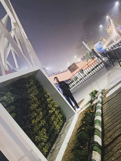 Another perspective of the Nehru Stadium project, showcasing the clean white frame that encases the living wall.