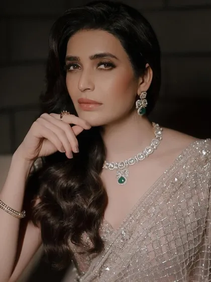 Confidence is the best accessory. Here, Karishma Tanna embodies modern elegance in a diamond and emerald necklace set, perfect for a cocktail evening or a glamorous reception. The design is sleek, sophisticated, and utterly captivating.