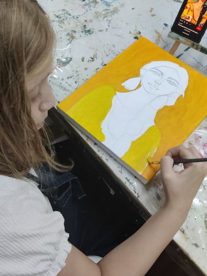 Follow along as a young student works diligently on her portrait painting, from the first outline to the final expressive details.
