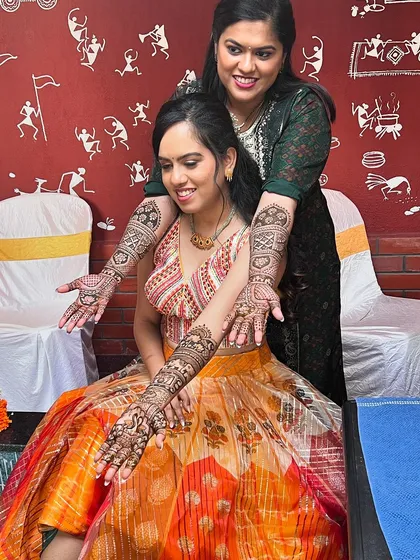 A beautiful moment between sisters, both adorned with my mehendi designs for the wedding celebration.