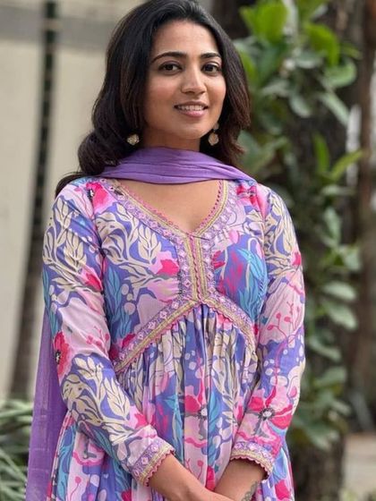 A vibrant and playful multicolor kurta pant set. The floral and abstract print in shades of purple and blue makes it a unique piece for your wardrobe.