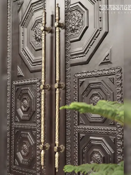The Raga door pulls seen here in context, mounted on the grand double doors. The vertical lines of the handles draw the eye upward, accentuating the height and presence of the entrance and creating a sense of arrival.