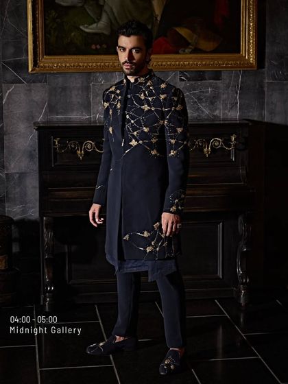 My designs don't just dress you up, they level you up. This black and gold embroidered jacket is a power silhouette, an entrance waiting to happen.