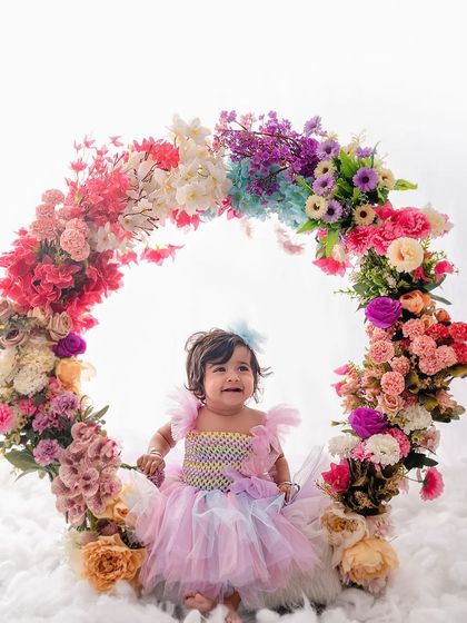 A happy smile from this little girl, surrounded by a rainbow of flowers. These sessions are like a breath of fresh spring air.