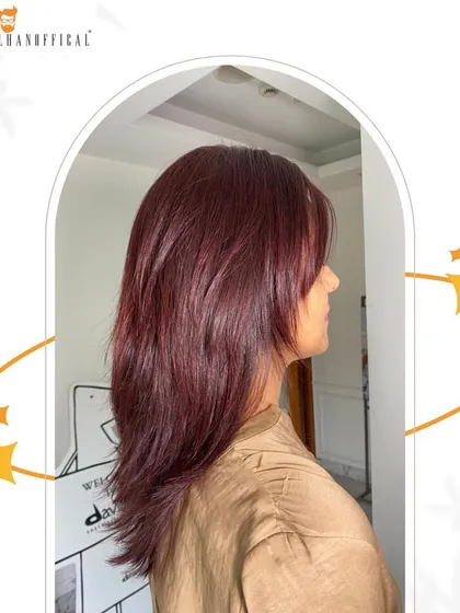 Step into the spotlight with a red hair shine glam. This vibrant color combined with soft layers creates a show-stopping look.