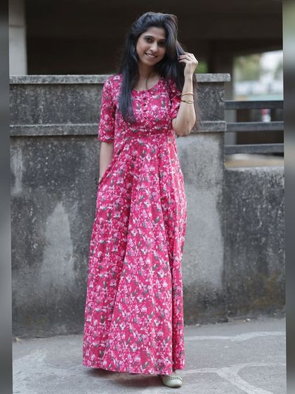 Twirl into elegance with this newly launched pink long flare dress. It’s designed to steal the spotlight with its beautiful print and flowing silhouette.