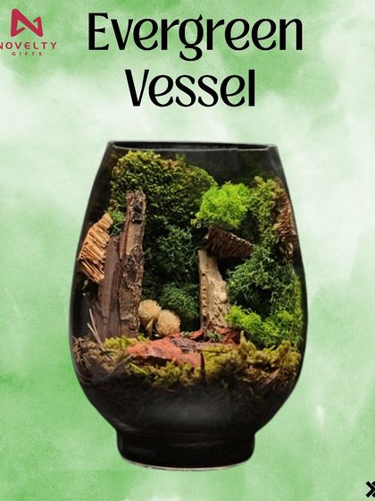 A lush miniature forest scene is crafted inside this 'Evergreen Vessel' terrarium. It’s a stunning, maintenance-free piece of natural art that brings tranquility indoors.