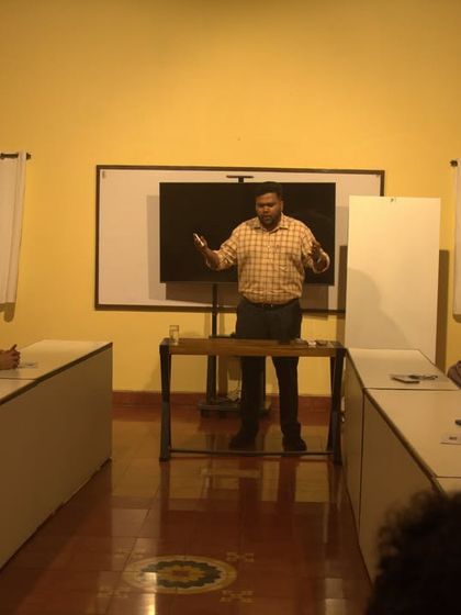 Dr. Arun Gopinath engaging with the audience during a talk on how to bring Ayurvedic balance into daily life.