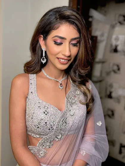 Eyes closed, this shot highlights the soft pink eyeshadow and the perfect blending.