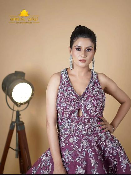 A close-up of our magenta evening gown. The halter neck and heavily embellished bodice are designed to flatter and create a sophisticated look.