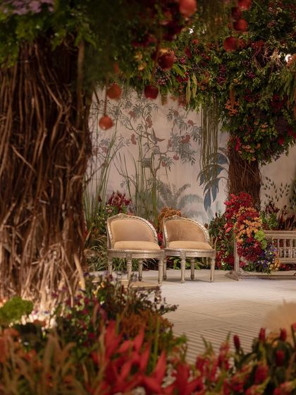 The parents' seating area at the naming ceremony, set within the magical indoor orchard.