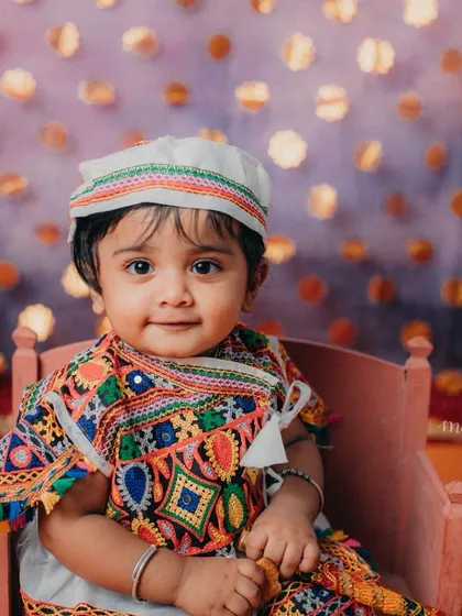 A beautiful portrait of our little Radha, with a sweet smile that lights up the room.