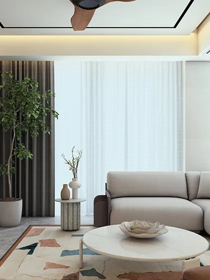A living room where finesse meets warmth, designed for a high-rise apartment. The space balances sleek lines with tactile materials, using lighter tones, natural stone, and refined finishes to create an atmosphere that feels both sophisticated and inviting.