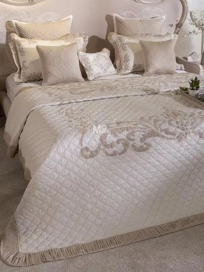 Our Magnolia-Themed Bed Cover Set is a celebration of minimalistic luxury and meticulous craftsmanship. This ensemble features delicate aari and aada embroidery in sophisticated patterns, finished with classic ghimp detailing and soft pleated fringes for a truly timeless bedroom centerpiece.